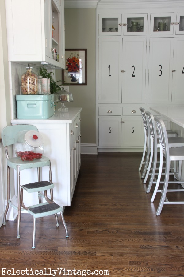 White farmhouse kitchen - love the pantry behind those numbered cabinets! kellyelko.com