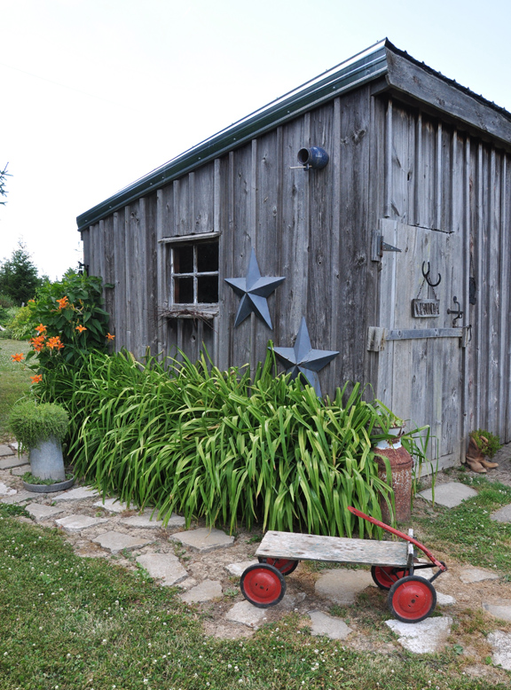 Weathered wood shed is part of this charming garden tour kellyelko.com