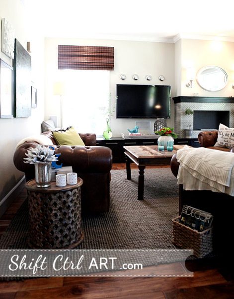 Cozy living room - love the tufted leather sofa and the rustic coffee table kellyelko.com