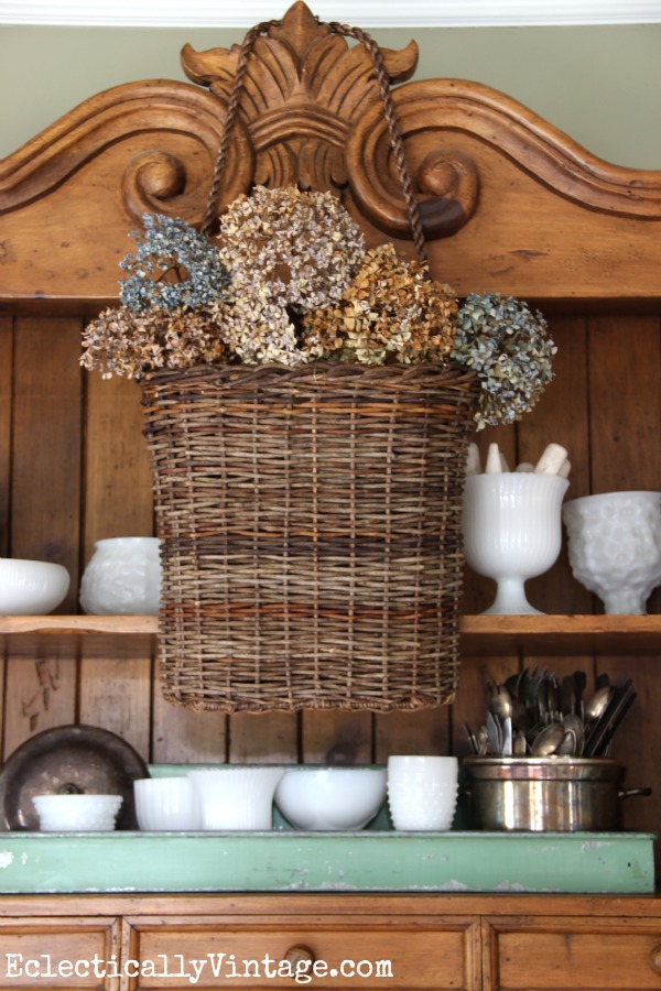 This hanging basket filled with dried hydrangeas is gorgeous! kellyelko.com #EclecticallyFall
