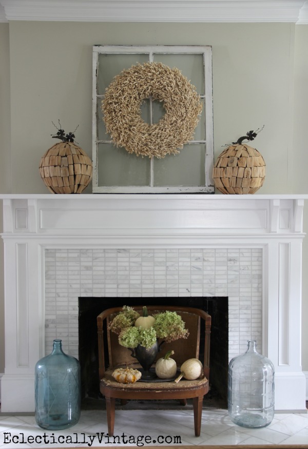 Creative Fall Decorating Ideas Home Tour - love the driftwood pumpkins and the little chair fireplace screen! kellyelko.com