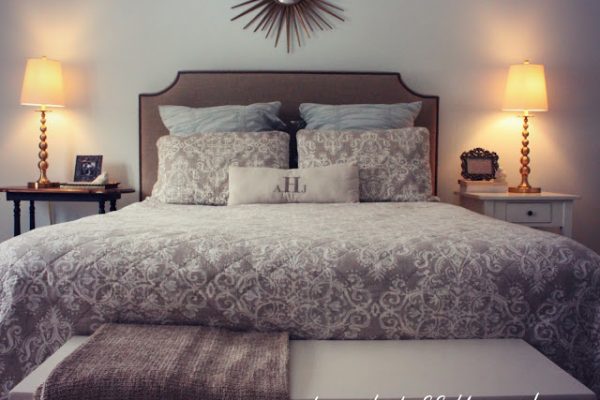 Love the sunburst mirror over the bed kellyelko.com