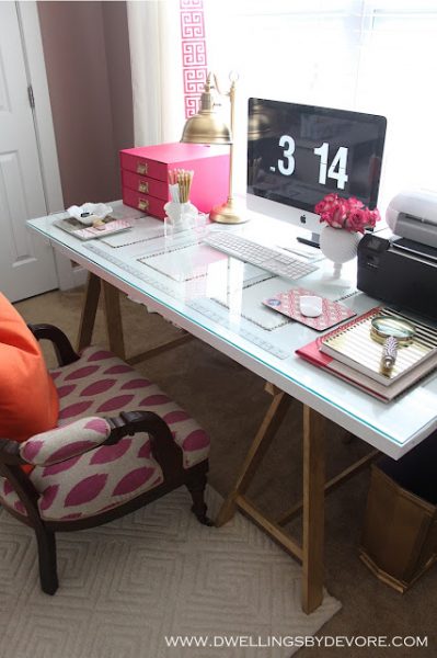 Sawhorse desk - love the fun pops of pink kellyelko.com