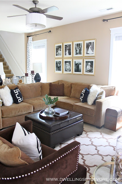 Cozy living room - love the gallery wall of framed photos kellyelko.com