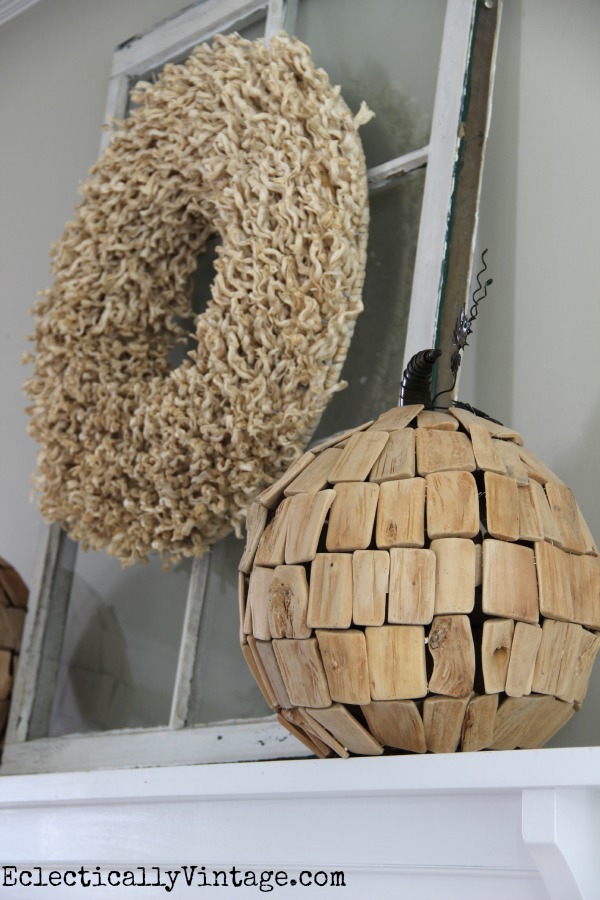 I love the texture on this neutral wreath and that driftwood pumpkin! kellyelko.com