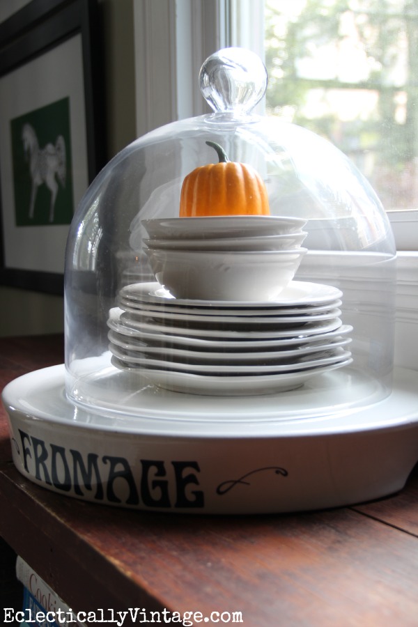 Fun way to display favorite plates - under a cloche kellyelko.com #EclecticallyFall