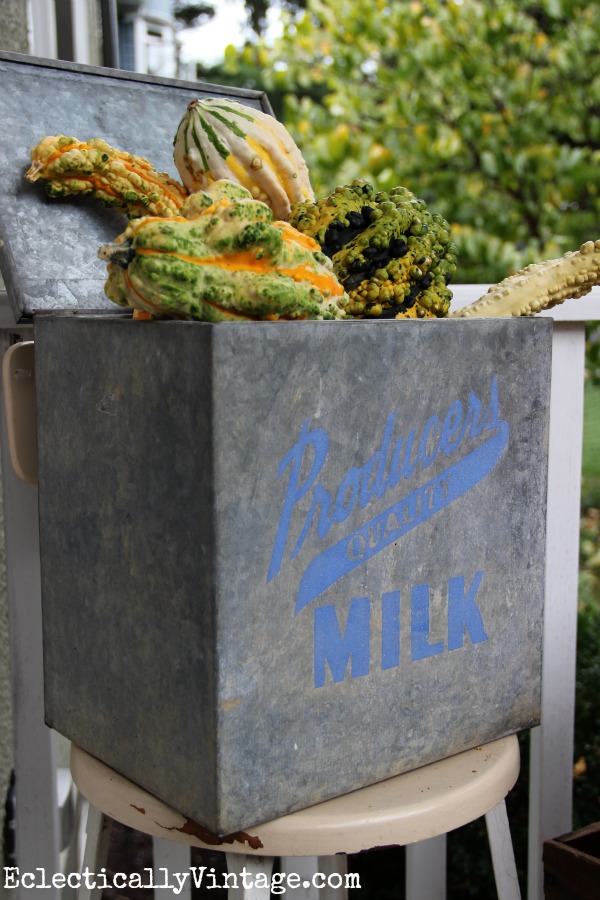 Cute vintage milk box filled with gourds for fall - such a fun fall porch eclectiallyvintage.com