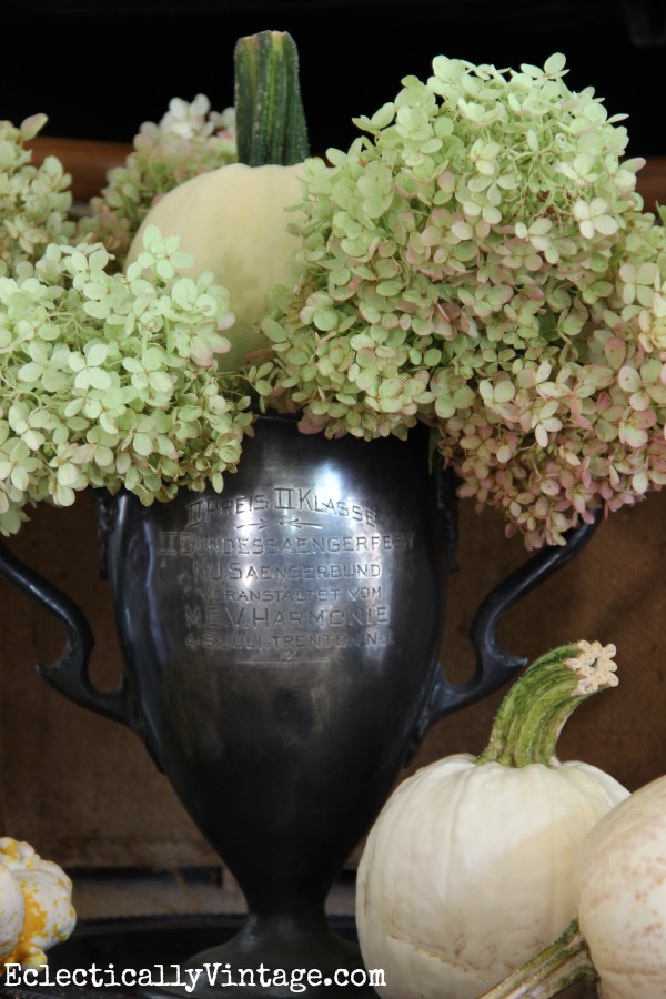 Vintage trophy filled with hydrangeas and pumpkins - such a creative fall home kellyelko.com