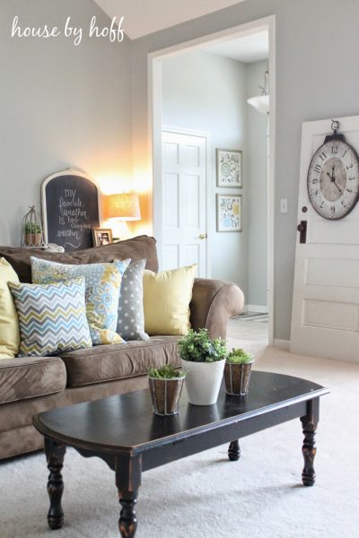 Cheery family room - love the mix of pillow patterns kellyelko.com