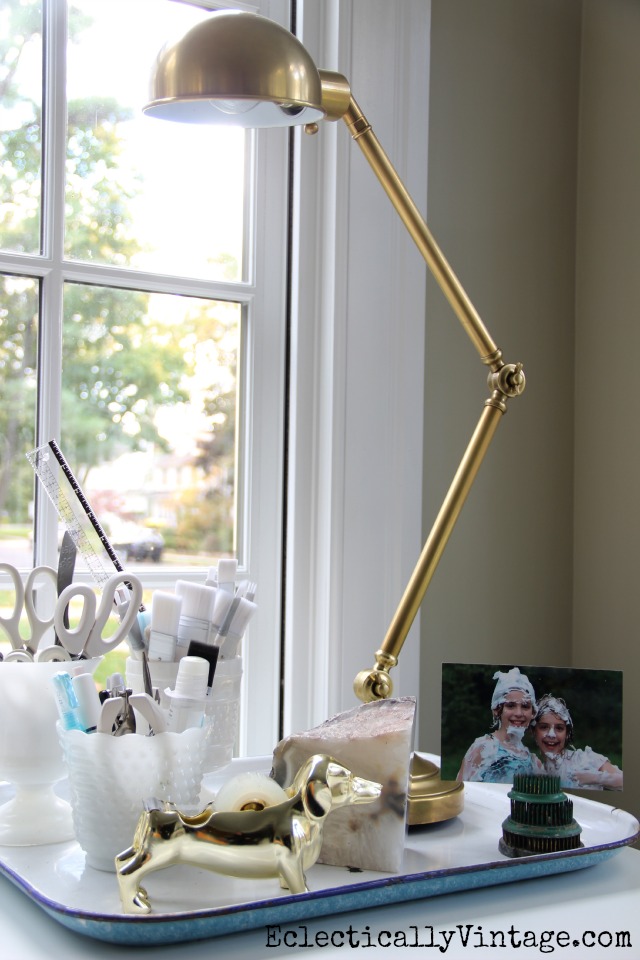 Brass is back and I love this vintage style articulated brass pharmacy lamp! kellyelko.com