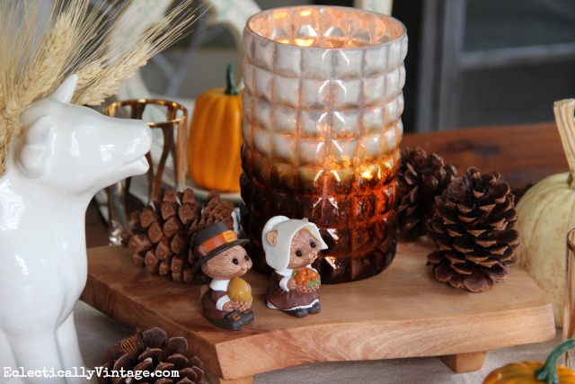 Love this rustic fall centerpiece with pinecones and that cute squirrel salt and pepper set! kellyelko.com