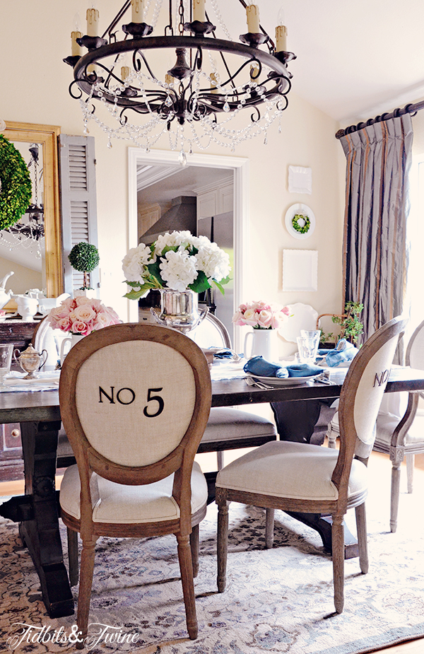 Eclectic Home Tour of Tidbits and Twine - love the numbered dining room chairs kellyelko.com