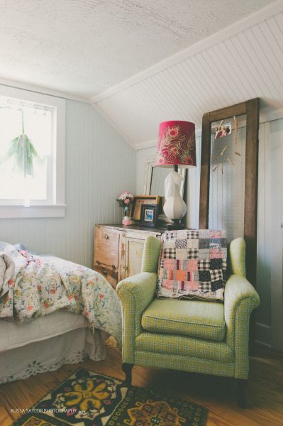 Vintage green chair is the perfect cozy reading spot in a bedroom kellyelko.com