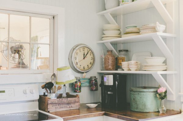 Charming cottage kitchen with open shelves for displaying collections kellyelko.com