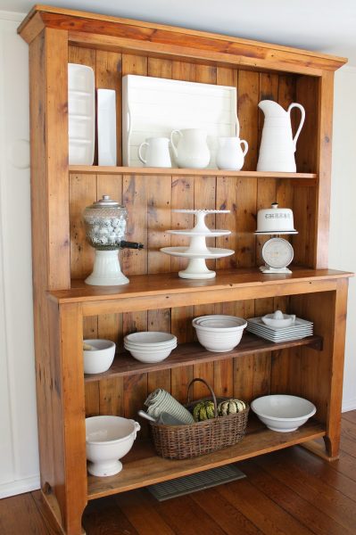 Beautiful hutch displays white bowls, platters and cake stands kellyelko.com