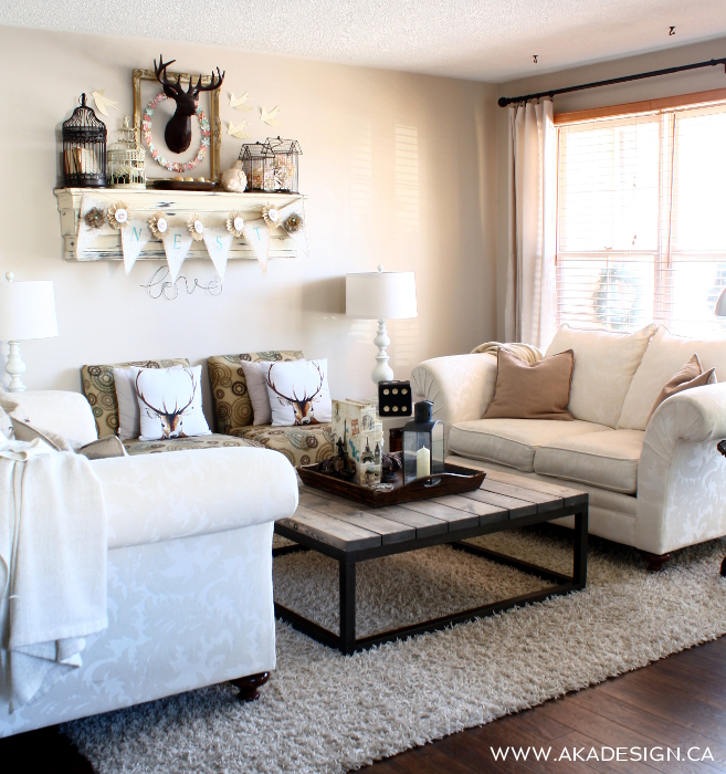 Beautiful neutral living room - love the cozy throws and deer pillows kellyelko.com