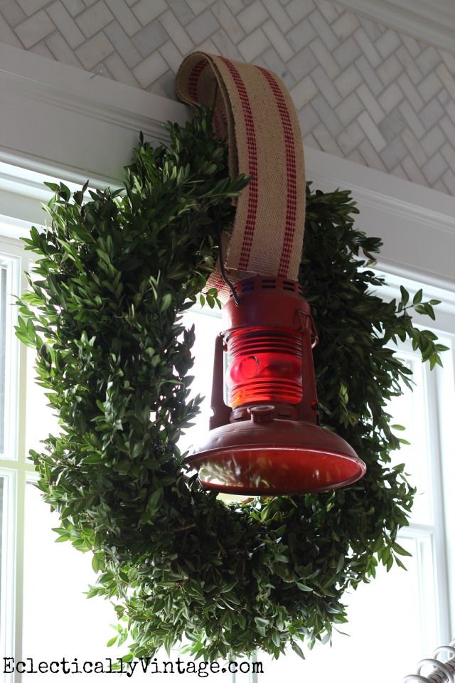 Boxwood wreath is festive with an old red lantern kellyelko.com