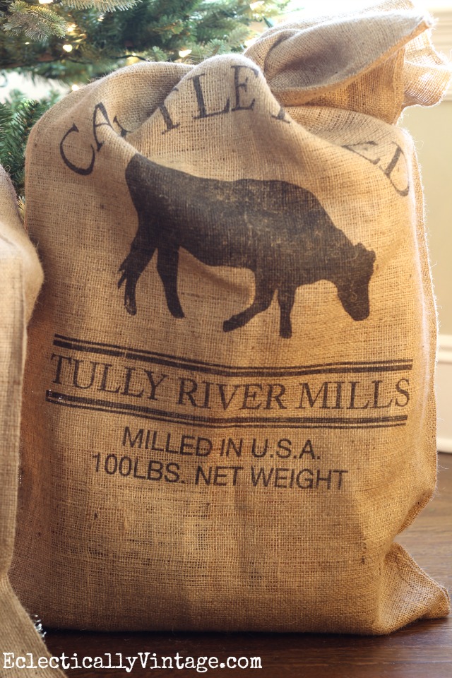 Love this cattle feed grain sack under the Christmas tree kellyelko.com