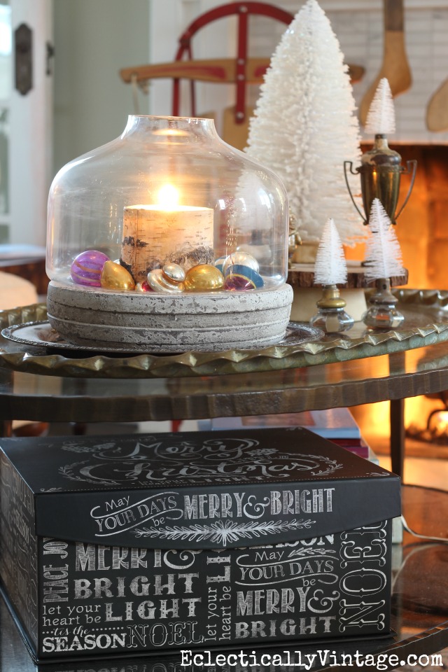 Love this Christmas coffee table - the candle and ornament filled terrarium kellyelko.com