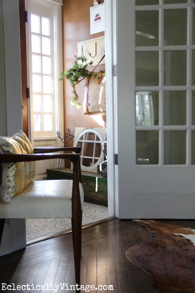 Cozy Christmas entrance - love the warm brown walls kellyelko.com