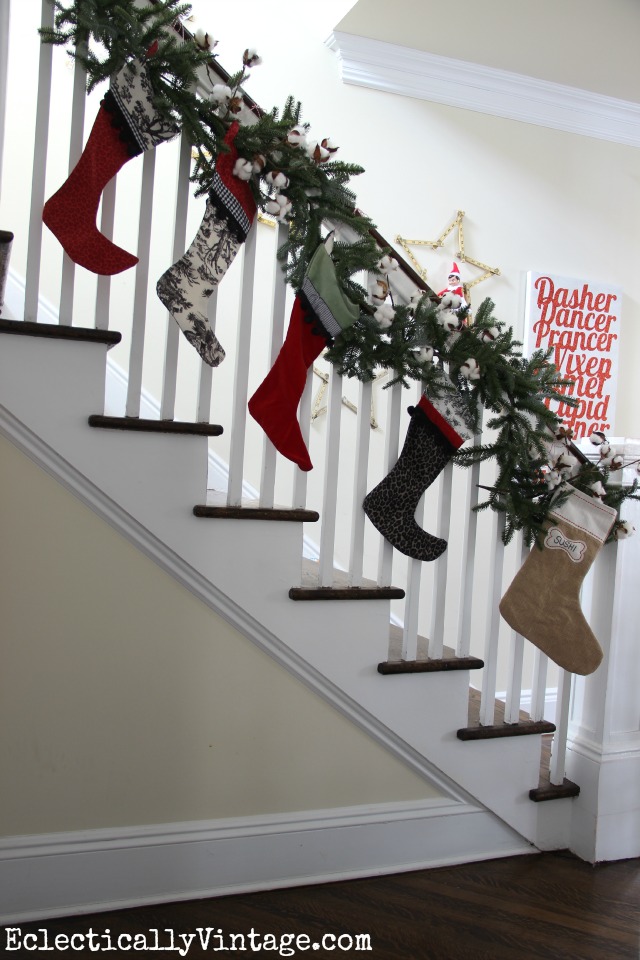 The stockings were hung on the Christmas bannister with care - love the fun stocking prints and the little dog stocking! kellyelko.com