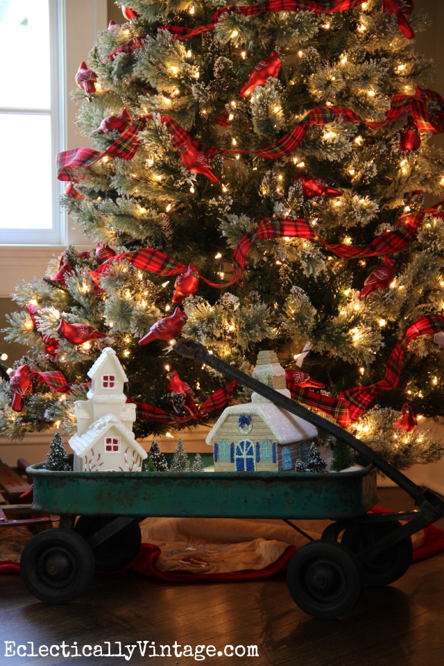 Fun plaid and bird theme Christmas tree and the cute little wagon Christmas village kellyelko.com