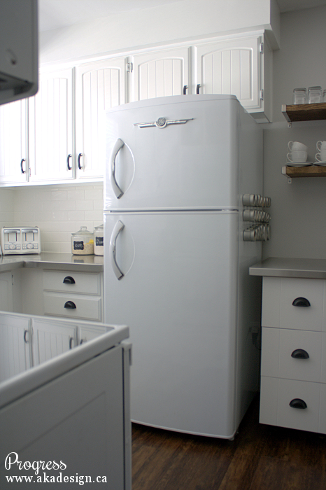 Love this retro refrigerator in this white cottage kitchen kellyelko.com