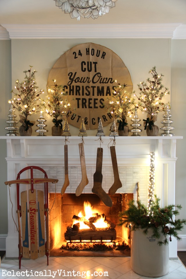 Rustic Christmas mantel with antique wood stockings - one of five creative Christmas mantels kellyelko.com