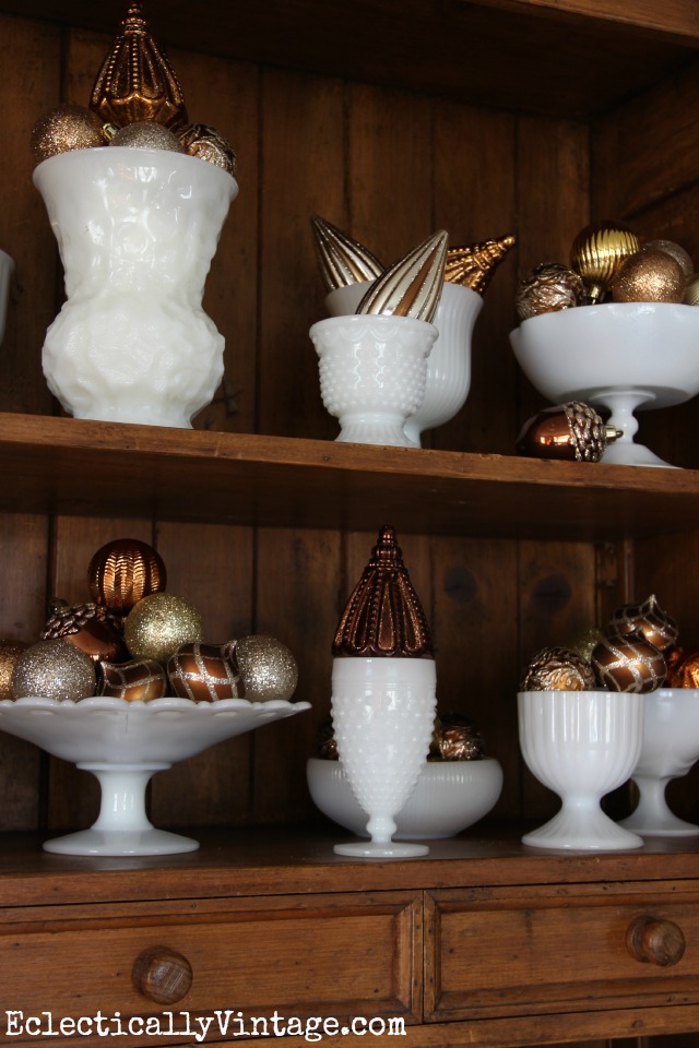 Vintage milk glass collection - fun way to display Christmas ornaments kellyelko.com