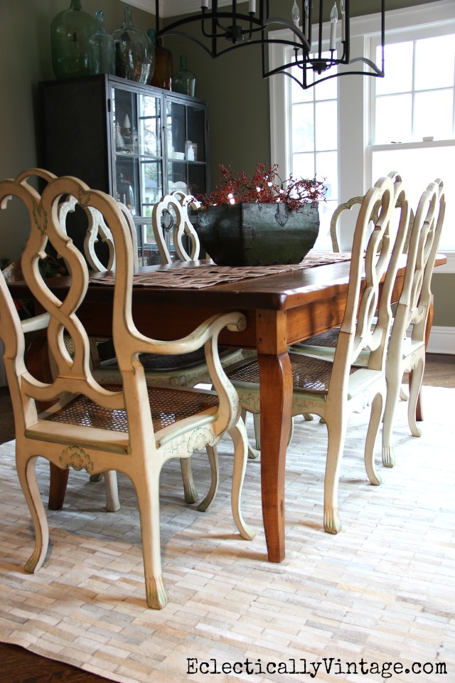 Love the pieced cowhide rug in this dining room kellyelko.com