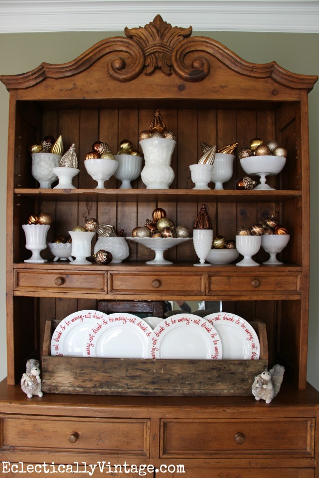 Christmas Dining Room Details - love the milk glass filled with ornaments kellyelko.com