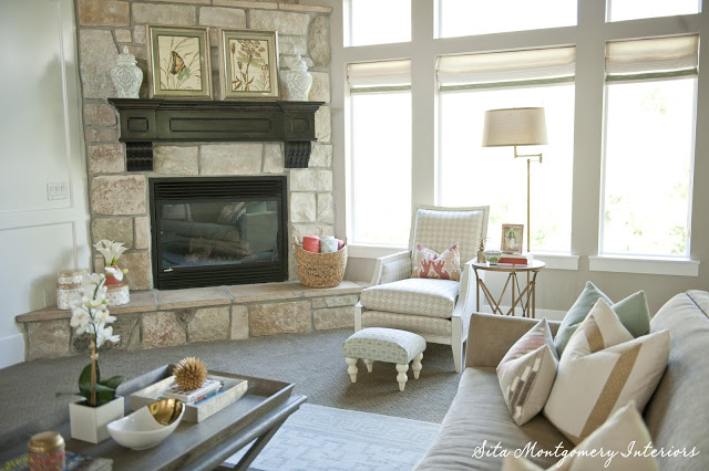 Beautiful stone fireplace in this stunning light and bright family room kellyelko.com