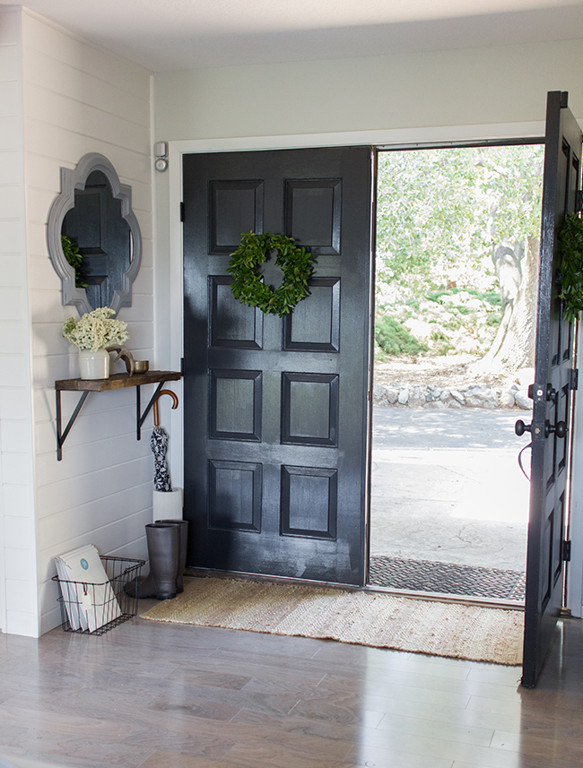 Stunning entryway - love the black front door and the planked wall kellyelko.com
