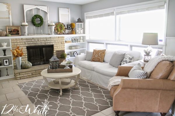 Neutral family room decor - love hte leather club chair kellyelko.com