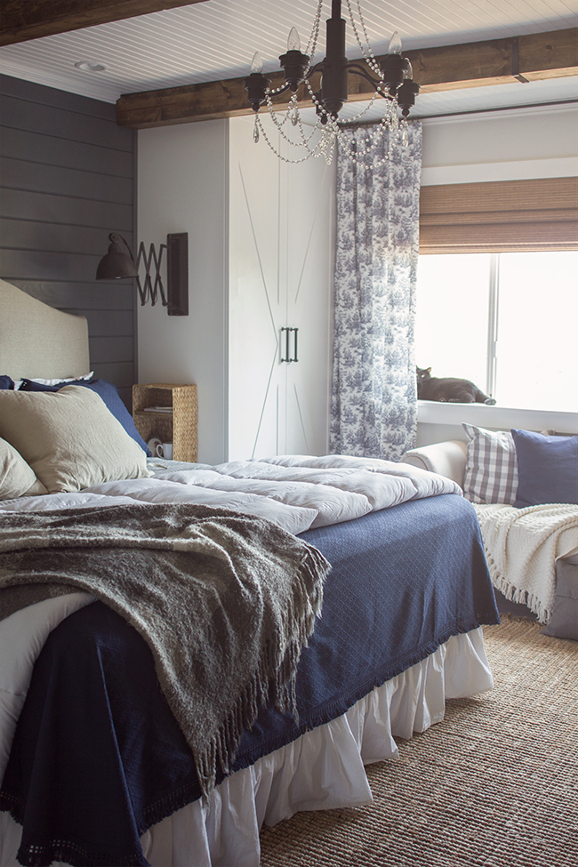 This master bedroom is stunning and all DIY - from the beadboard ceiling to the rustic beams to the built in cabinets with sconces kellyelko.com