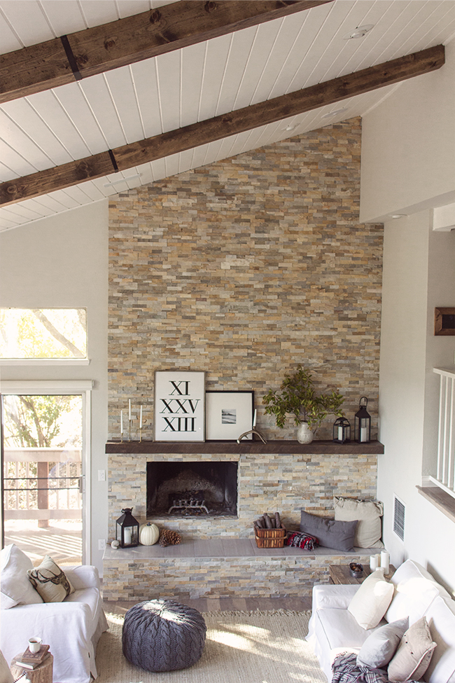 Gorgeous home tour featuring tons of DIY ideas on a budget - love the floor to ceiling tile fireplace and the plank ceiling kellyelko.com