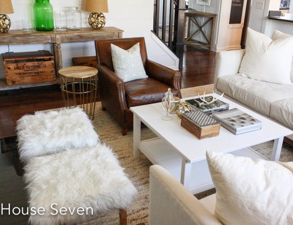 Cozy family room - love the mix of wood, painted coffee table, leather and faux fur kellyelko.com