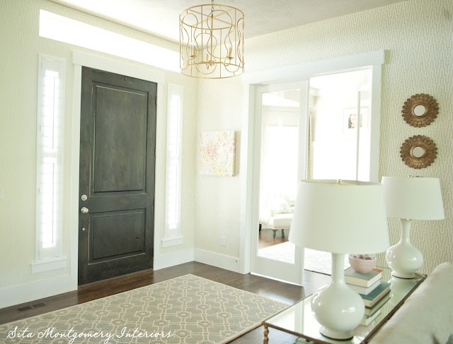 Gorgeous entry foyer - love the dark stained interior door kellyelko.com