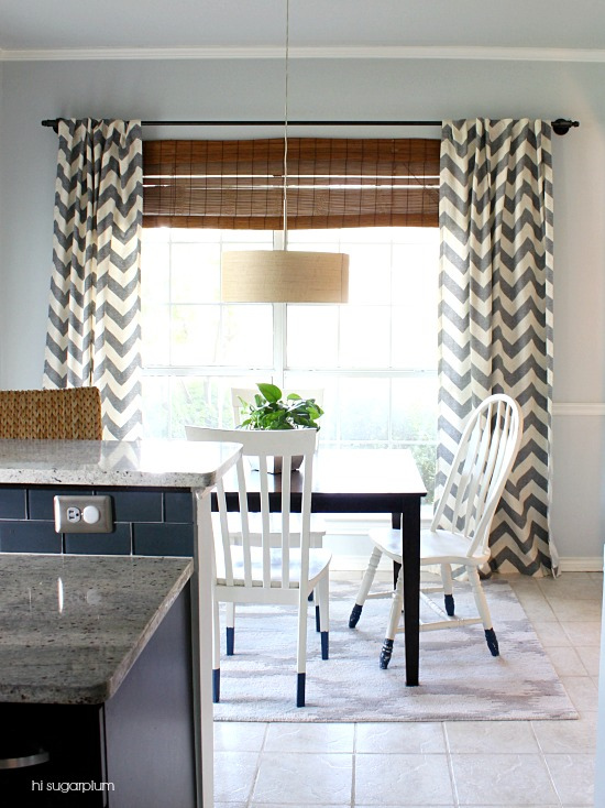 DIY industrial pipe curtain rod with chevron curtains - and I love the dip dyed chair legs kellyelko.com