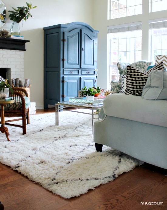 Gorgeous living room with fun color and pattern and love the blue armoire kellyelko.com