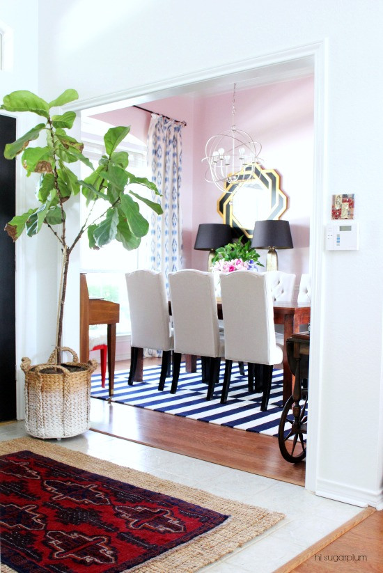 Love this colorful home - and the pink dining room with a red ceiling kellyelko.com