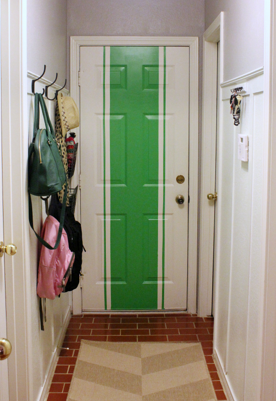 Fun mudroom door with bold green stripe kellyelko.com