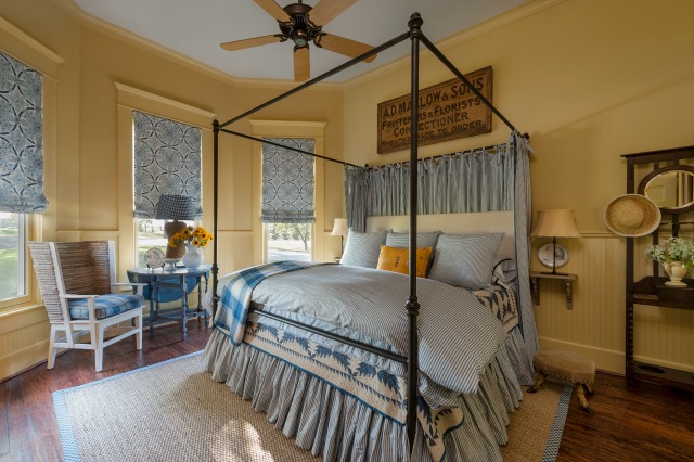 Cozy yellow and blue bedroom - love the four poster bed and the brackets instead of nightstands kellyelko.com