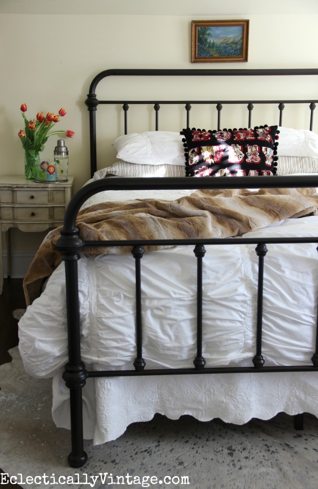 Cozy up white bedding with a fur throw and a fun pillow kellyelko.com