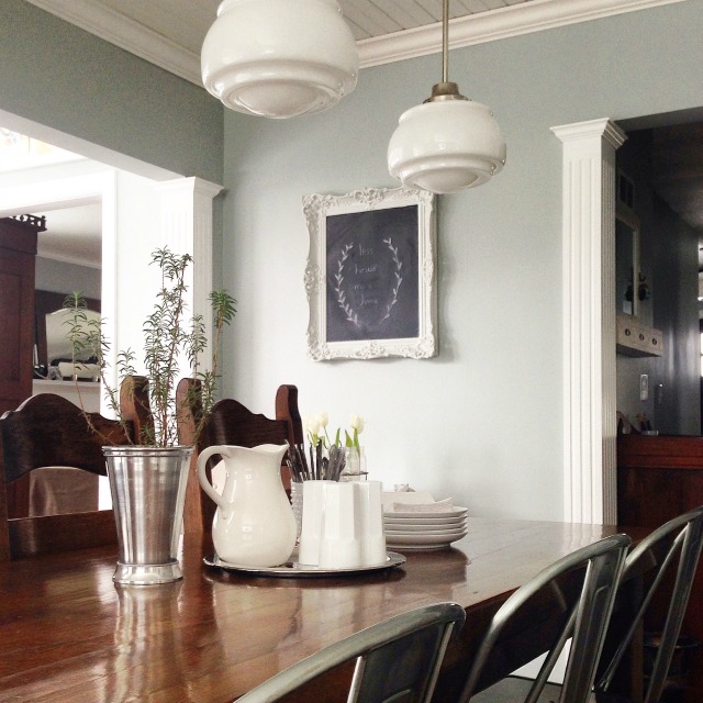 Farmhouse dining room - love the mismatched chairs and school house lights kellyelko.com