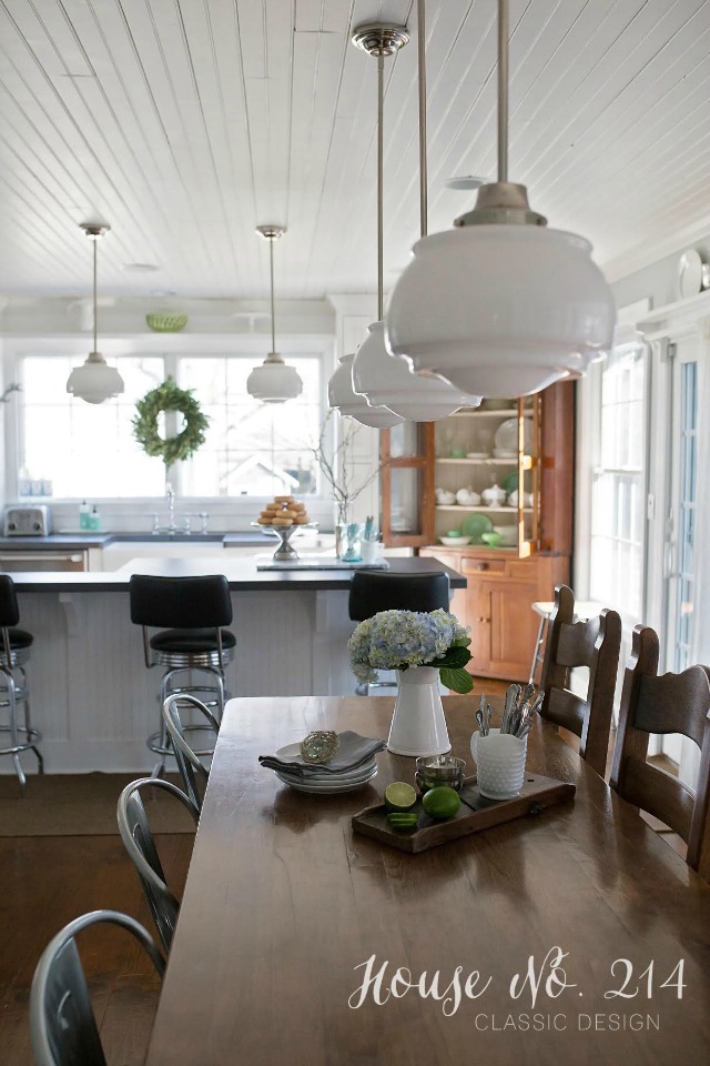 Love this farmhouse kitchen - look at those schoolhouse lights! kellyelko.com