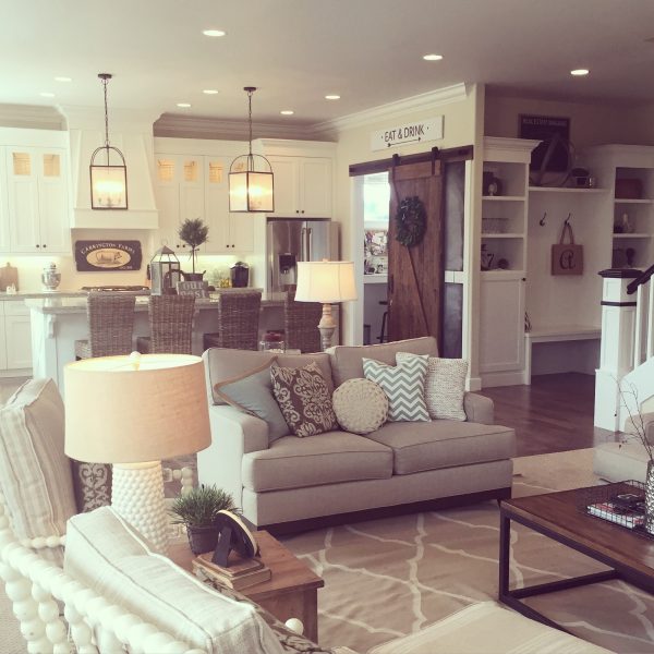 Open floor plan kitchen and family room in neutrals - love the farmhouse style kellyelko.com