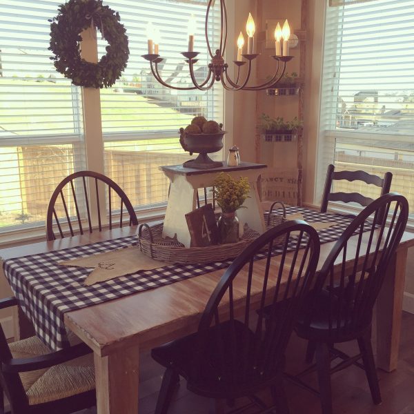 Breakfast nook with lots of light - love the mismatched chairs and chandelier kellyelko.com