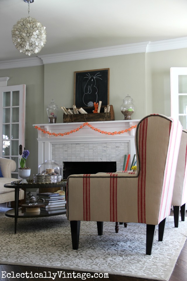 Love this living room decorated for spring and those red striped grain sack chairs are fabulous! kellyelko.com