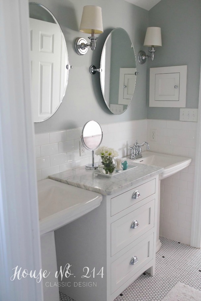 Love the double sinks with the carrara topped cabinet in between kellyelko.com